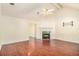 Bright living room with a vaulted ceiling, fireplace, and hardwood flooring at 11941 Fairway Overlook, Fayetteville, GA 30215