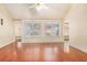 Spacious living room featuring vaulted ceiling, hardwood floors, and bright windows at 11941 Fairway Overlook, Fayetteville, GA 30215