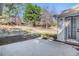 A concrete patio with a door leading into the home at 11941 Fairway Overlook, Fayetteville, GA 30215