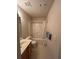 Bathroom featuring a shower-tub combo, vanity with sink, and white tile flooring at 684 Beranda Cir, Douglasville, GA 30134