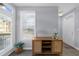 View of entryway features storage cabinet, large window and light gray walls at 1115 Mcgill Park Ne Ave, Atlanta, GA 30312