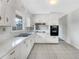 Efficient kitchen featuring white cabinetry, ample counter space, and essential appliances for functionality at 1742 Mural Dr, Morrow, GA 30260