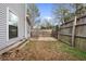 Fenced backyard with grassy area and stone pavers at 3177 Shadow Walk Ln, Tucker, GA 30084