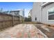 Fenced backyard with stone pavers and grassy area at 3177 Shadow Walk Ln, Tucker, GA 30084