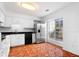 Well-lit kitchen with stainless steel appliances, white cabinets, and a window for natural light at 3177 Shadow Walk Ln, Tucker, GA 30084