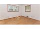 Bedroom with hardwood flooring and natural light coming in through two windows at 3951 Lindley Dr, Powder Springs, GA 30127