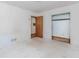 Bedroom featuring white walls, light floors, and view of a closet at 3951 Lindley Dr, Powder Springs, GA 30127