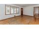 Empty room featuring hardwood floors, a front-facing window, and white walls at 3951 Lindley Dr, Powder Springs, GA 30127