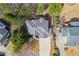 Aerial view of a house featuring a well-maintained roof, lush landscaping, and inviting outdoor deck at 403 Mill Xing, Canton, GA 30114