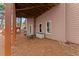 View of back patio with two chairs, outdoor furniture, and entry door at 403 Mill Xing, Canton, GA 30114