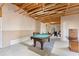 Unfinished basement with a pool table, providing ample space for recreational activities at 403 Mill Xing, Canton, GA 30114