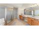 Bright bathroom featuring double vanity, soaking tub, and separate glass shower at 403 Mill Xing, Canton, GA 30114