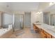 Bright bathroom featuring double vanity, soaking tub, and separate glass shower at 403 Mill Xing, Canton, GA 30114