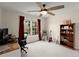 Bedroom with large window, ceiling fan, desk, and built in bookshelves at 403 Mill Xing, Canton, GA 30114