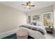 Inviting bedroom featuring neutral walls, ceiling fan, and lots of natural light at 403 Mill Xing, Canton, GA 30114