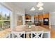 Open breakfast nook with backyard view, breakfast table and close proximity to kitchen at 403 Mill Xing, Canton, GA 30114