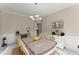 Dining room with a chandelier, a table with seating for six, neutral paint, and decorative wall accents at 403 Mill Xing, Canton, GA 30114