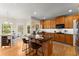 Modern kitchen with stainless steel appliances, dark countertops, a kitchen island, and hardwood floors at 403 Mill Xing, Canton, GA 30114