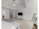 Carpeted main bedroom featuring tray ceiling, ensuite bathroom and walk-in closet at 403 Mill Xing, Canton, GA 30114