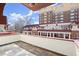 Private balcony featuring patterned slate tile flooring and views of the property's grounds and neighboring buildings at 746 N Highland Ne Ave # 11, Atlanta, GA 30306