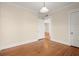 Bright bedroom featuring hardwood floors and access to the hallway at 746 N Highland Ne Ave # 11, Atlanta, GA 30306