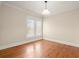 Cozy bedroom with hardwood floors, neutral walls, and natural light from large windows at 746 N Highland Ne Ave # 11, Atlanta, GA 30306