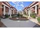 Picturesque courtyard featuring manicured landscaping, a water feature, and symmetrical pathways between buildings at 746 N Highland Ne Ave # 11, Atlanta, GA 30306