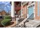 Inviting condo entrance with a blue door, brick facade and updated stairs at 746 N Highland Ne Ave # 11, Atlanta, GA 30306