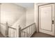 Hallway staircase leading to unit with neutral colors and traditional design at 746 N Highland Ne Ave # 11, Atlanta, GA 30306