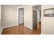 Spacious living room showcasing hardwood floors and view of kitchen and hallway at 746 N Highland Ne Ave # 11, Atlanta, GA 30306