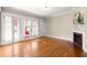 Bright living room with hardwood floors, fireplace and french doors to balcony at 746 N Highland Ne Ave # 11, Atlanta, GA 30306