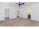 Spacious bedroom featuring neutral carpet, ceiling fan, and access to a walk-in closet and ensuite bathroom at 898 Center Hill Nw Ave, Atlanta, GA 30318