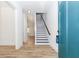 Bright entryway with hardwood floors and a staircase with black accents at 898 Center Hill Nw Ave, Atlanta, GA 30318