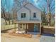 Classic two-story home with a covered porch, stone accents and a well manicured gravel driveway at 898 Center Hill Nw Ave, Atlanta, GA 30318