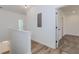 Hallway with wood floors and carpet, features white walls and doors, and light fixtures at 898 Center Hill Nw Ave, Atlanta, GA 30318