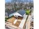 Aerial view showcases the home's charming exterior with a inviting front porch and a newly paved driveway at 907 Oakhill Sw Ave, Atlanta, GA 30310