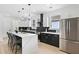 Modern kitchen with stainless steel appliances, large island, and stylish pendant lighting at 907 Oakhill Sw Ave, Atlanta, GA 30310