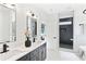 Bright bathroom highlighting a large double vanity, walk-in shower and modern fixtures at 907 Oakhill Sw Ave, Atlanta, GA 30310