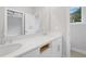 Modern bathroom featuring a double vanity, large mirror and natural light from the window at 1324 Parc Bench Rd, Atlanta, GA 30316