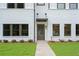 Inviting front entrance with a view of modern gray-and-white facade and minimalist landscaping at 1324 Parc Bench Rd, Atlanta, GA 30316