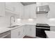 Sleek kitchen featuring white cabinets, stainless steel appliances, and quartz countertops at 1324 Parc Bench Rd, Atlanta, GA 30316