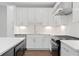 Modern kitchen featuring white cabinetry, stainless steel appliances, and quartz countertops at 1324 Parc Bench Rd, Atlanta, GA 30316