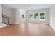 Bright, open living area featuring hardwood floors, natural light, and a staircase at 1324 Parc Bench Rd, Atlanta, GA 30316