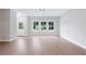 Spacious, light-filled living area with hardwood floors and large windows overlooking the neighborhood at 1324 Parc Bench Rd, Atlanta, GA 30316