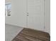 Entryway showcasing hardwood-style flooring leading to carpet with a white front door and window at 167 Silverton Dr, Dacula, GA 30019