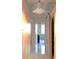 Hallway with decorative lighting fixture with glass pendants and gleaming tile floors at 2479 Peachtree Ne Rd # 1115, Atlanta, GA 30305