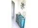 Hallway with a decorative turquoise cabinet with mirror and wall decor at 2479 Peachtree Ne Rd # 1115, Atlanta, GA 30305