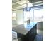 Kitchen island with white marble countertop, a view of the city, and modern lighting at 2479 Peachtree Ne Rd # 1115, Atlanta, GA 30305