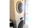 Efficient laundry area featuring a stacked washer and dryer at 2479 Peachtree Ne Rd # 1115, Atlanta, GA 30305