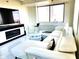 Bright living room featuring white furniture, large windows, and city views at 2479 Peachtree Ne Rd # 1115, Atlanta, GA 30305